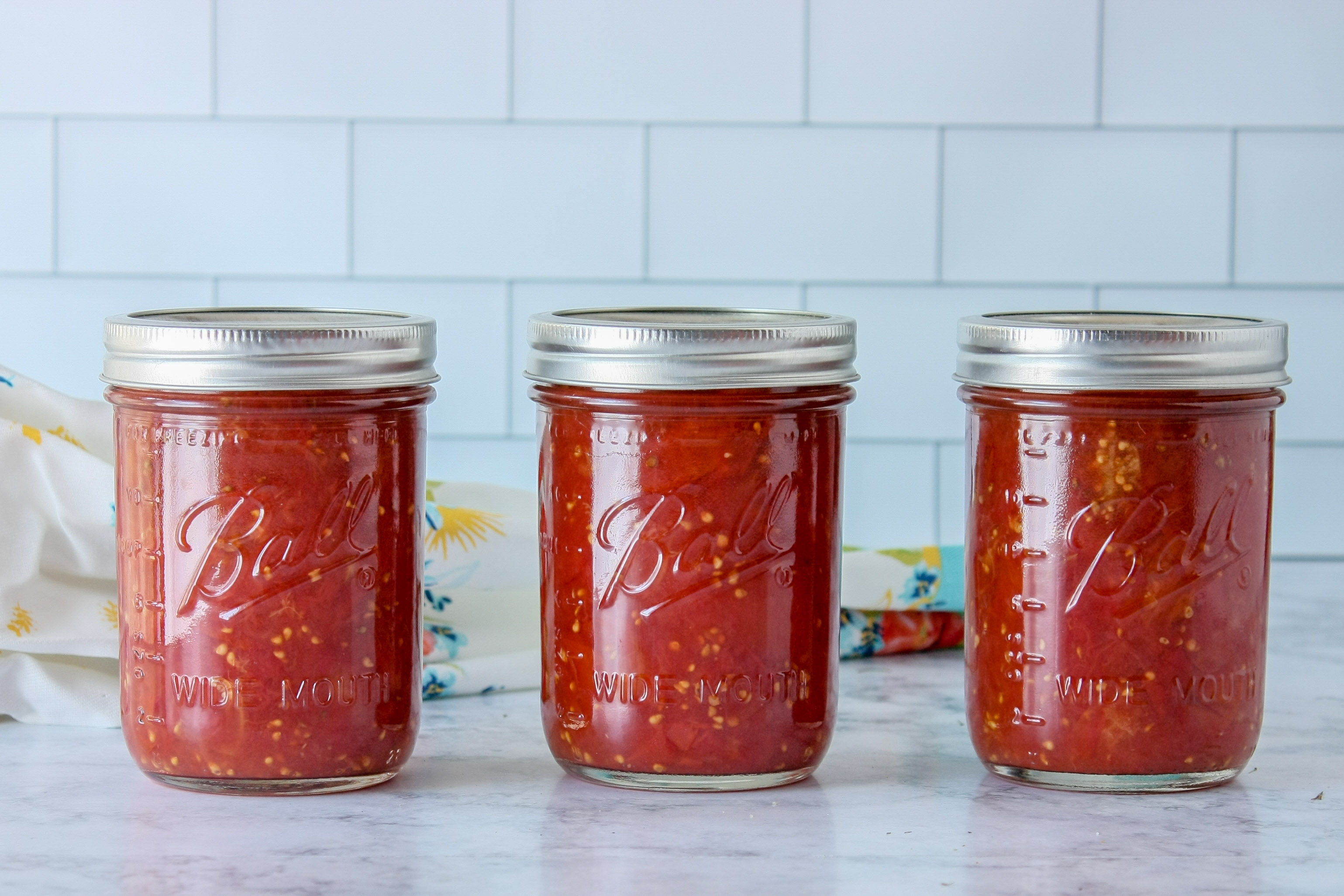 Jars of canned tomatoes