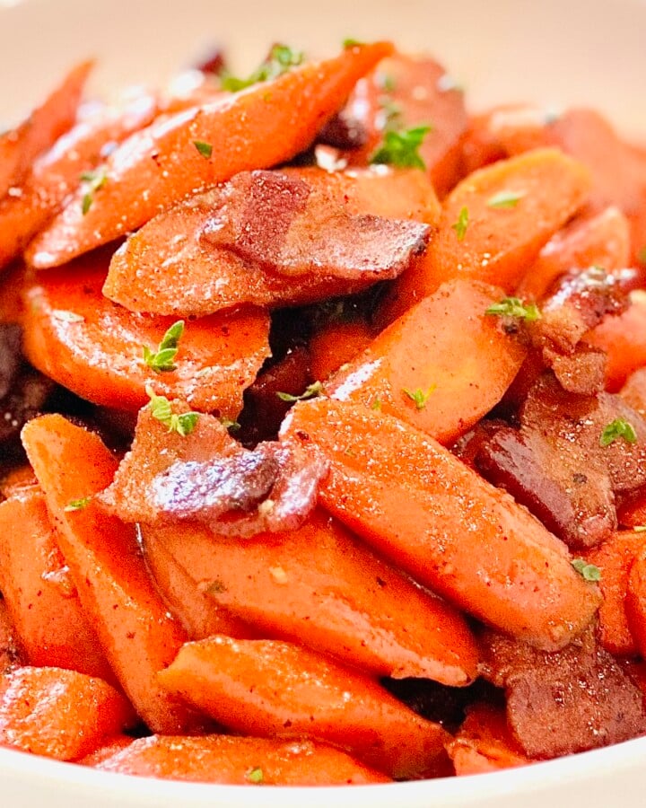 Simple glazed carrots recipe made with Dijon mustard, honey, and bacon, ready to serve for dinner or entertaining.