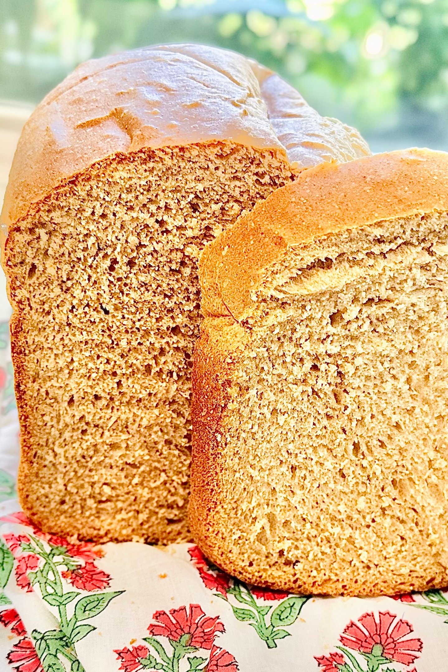 Golden brown loaf of beer bread with a crisp crust and soft, fluffy interior