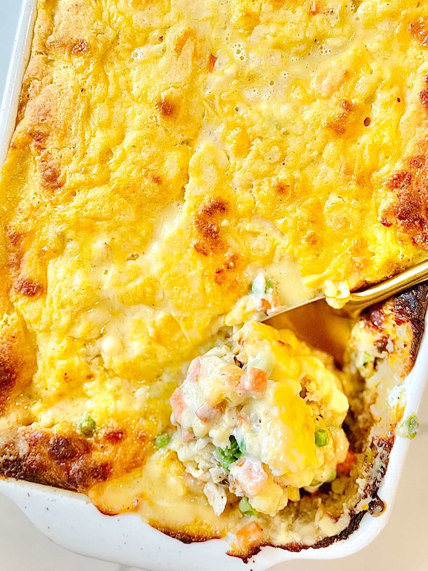 Cheesy biscuit topped chicken cobbler ready to serve for dinner