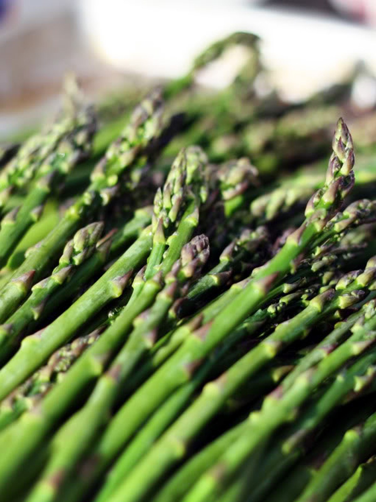 Fresh asparagus spears ready for grilling.