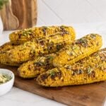 Easy grilled corn on the cob with garlic herb butter and smoky grill marks.