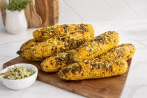 Easy grilled corn on the cob with garlic herb butter and smoky grill marks.