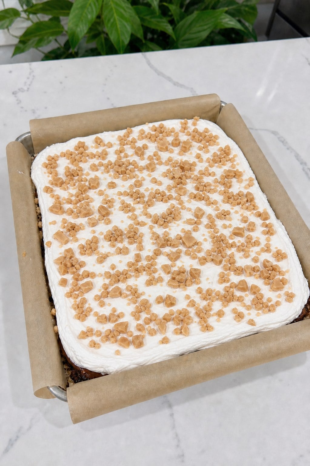 Chopped toffee bits scattered over the smooth Cool Whip topping.