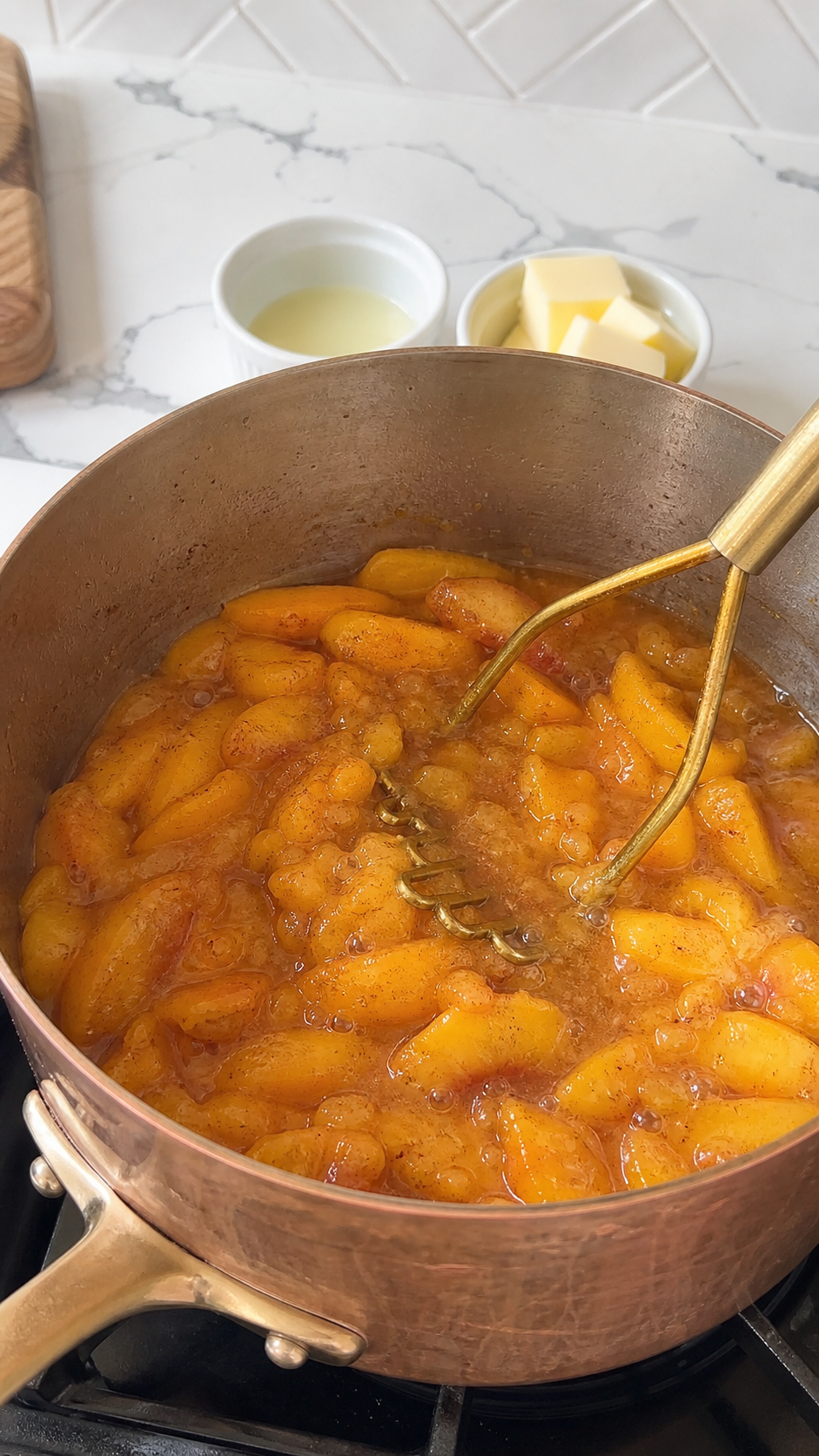 Fresh peach filling simmering with cinnamon and sugar for fried peach pies.