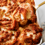 Spoonful of baked ziti with sausage, creamy ricotta and melted mozzarella cheese.