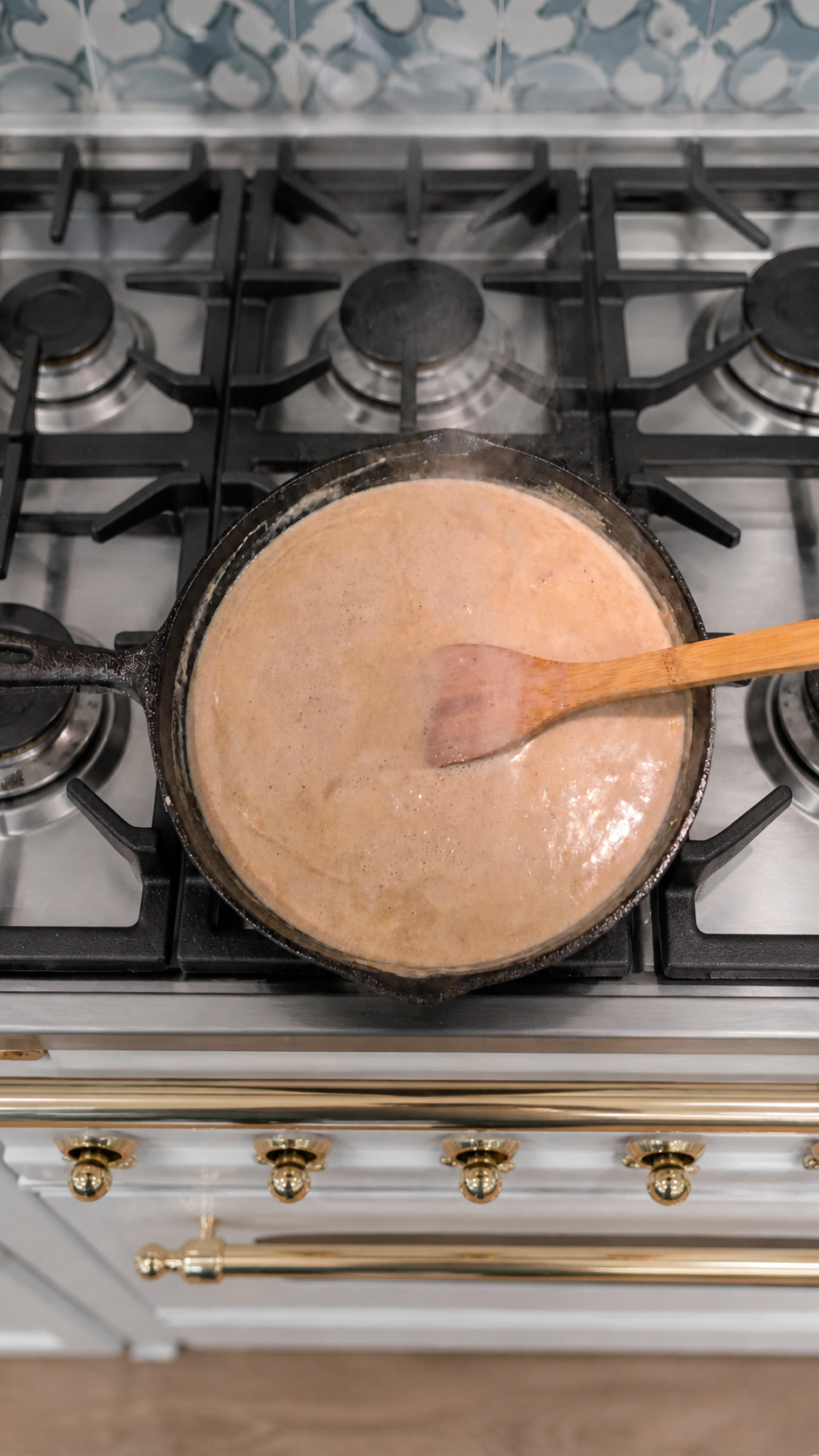 Smooth peppered cream gravy finished in a cast-iron skillet for chicken fried steak.