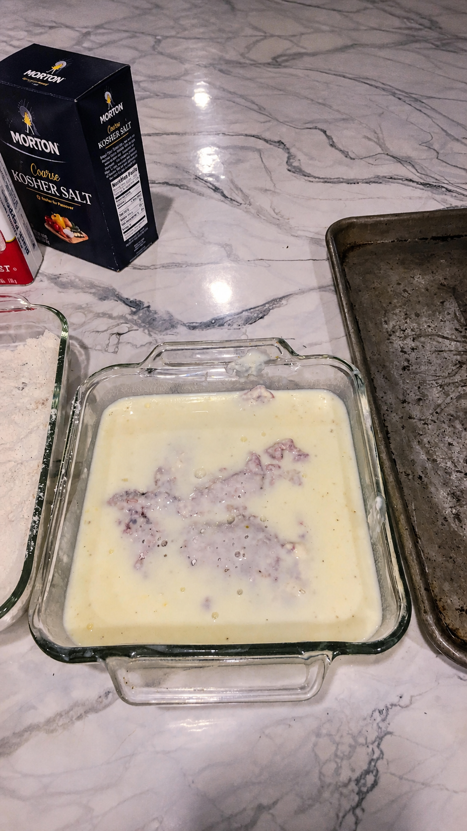 Floured steak dipped into the seasoned egg-and-milk mixture.
