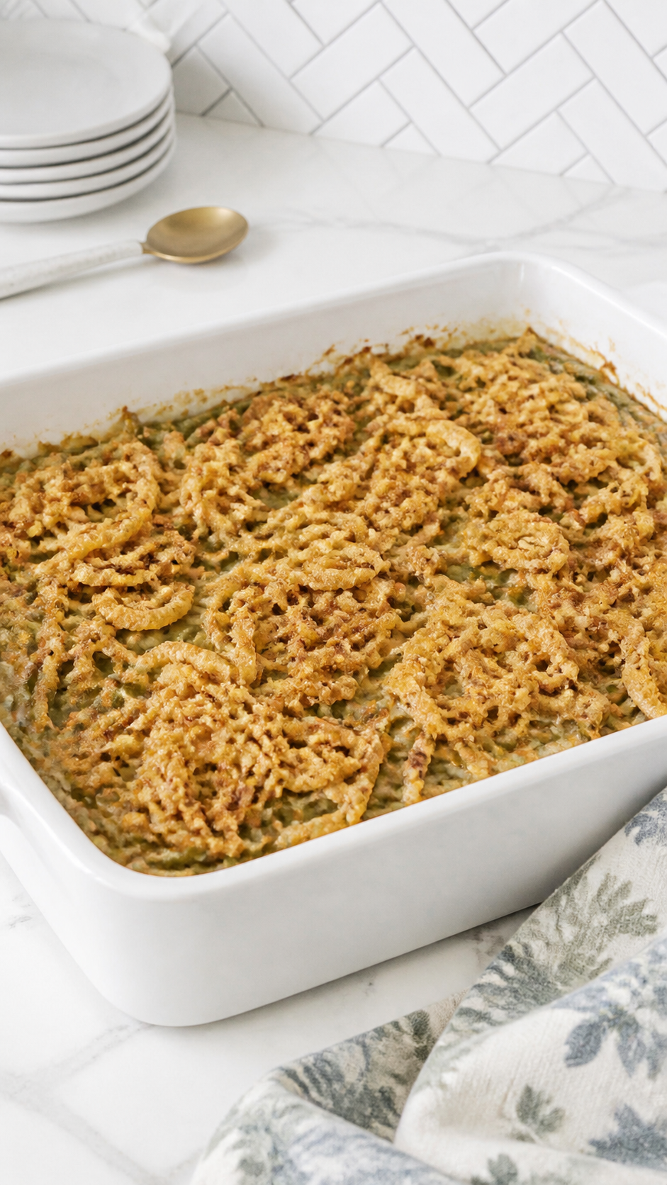 Finished crunchy green bean casserole with a golden French fried onion topping