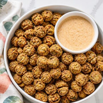 Close-up of deep golden fried okra showing its crisp cornmeal coating and green okra centers.
