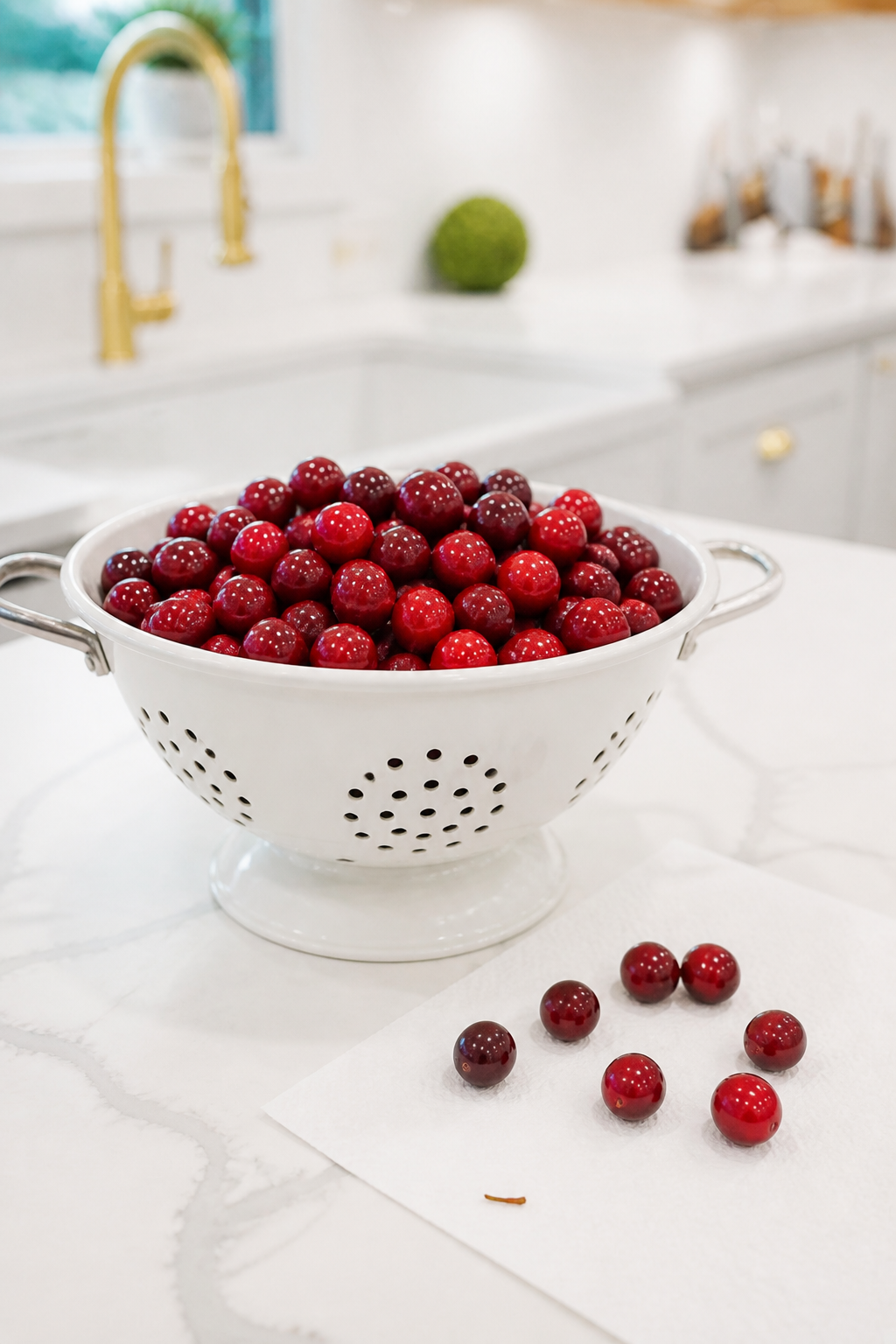 Fresh cranberries being rinsed and sorted before soaking.