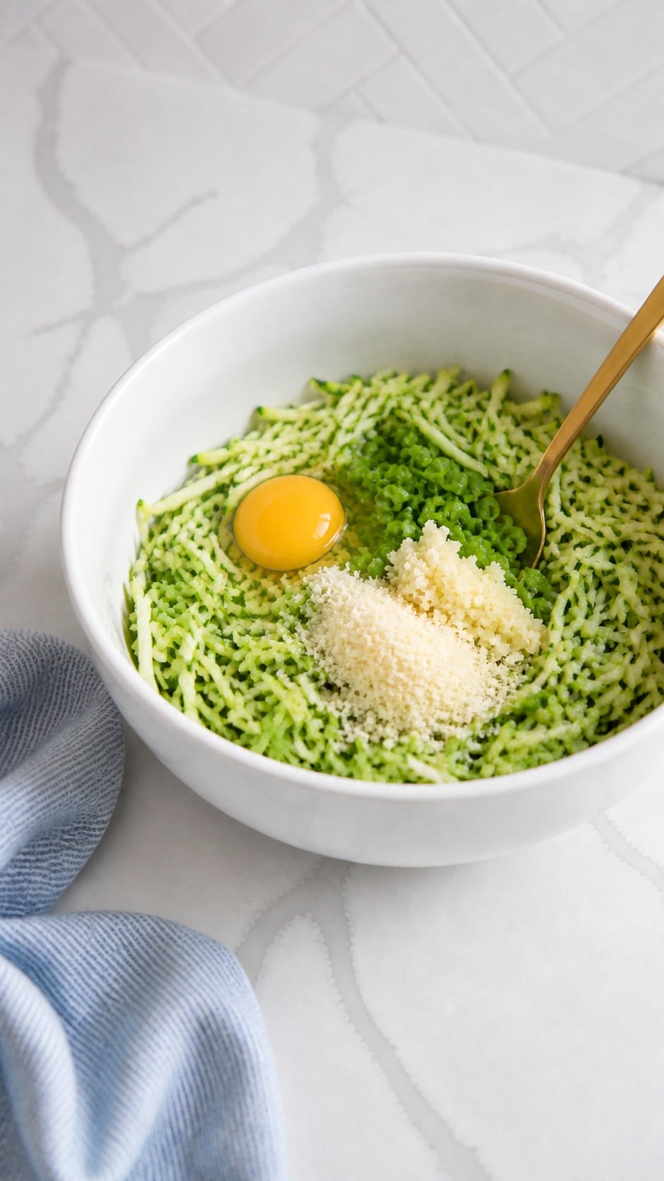 Drained zucchini mixed with egg, sliced green onions, grated Parmesan, and minced garlic.