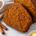 Close-up slices of Amish pumpkin bread showing the moist spiced crumb