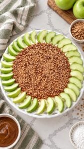 Overhead view of layered caramel apple dip with Granny Smith apple slices