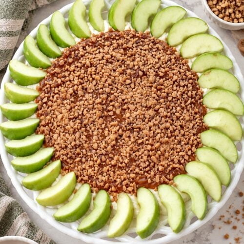 Overhead view of layered caramel apple dip with Granny Smith apple slices