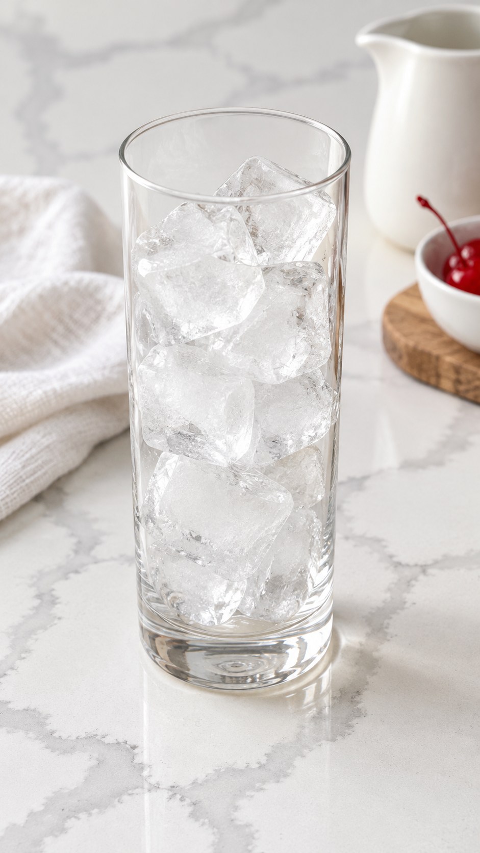 Highball glass filled with ice before adding the cocktail ingredients.