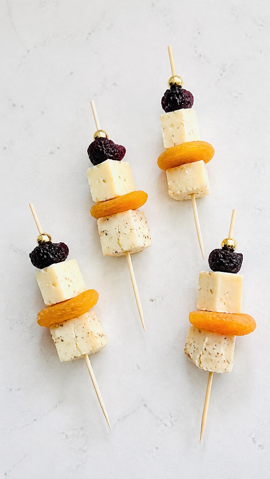 BellaVitano Merlot cheese skewers with dried apricots and dried cherries.