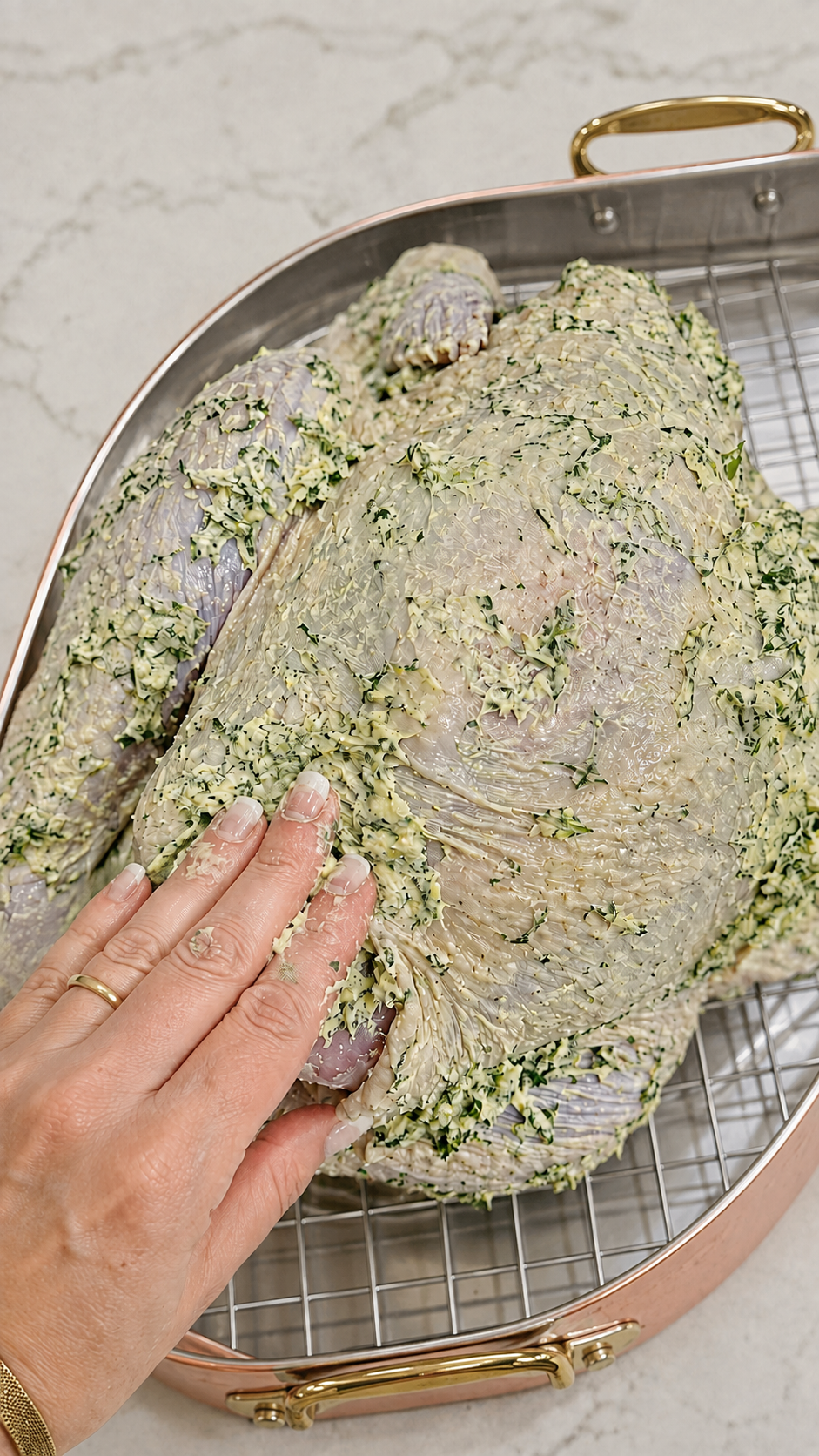 Herb butter spread underneath and over turkey skin