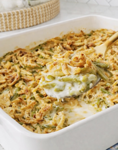 Finished crunchy green bean casserole served warm with golden fried onions.