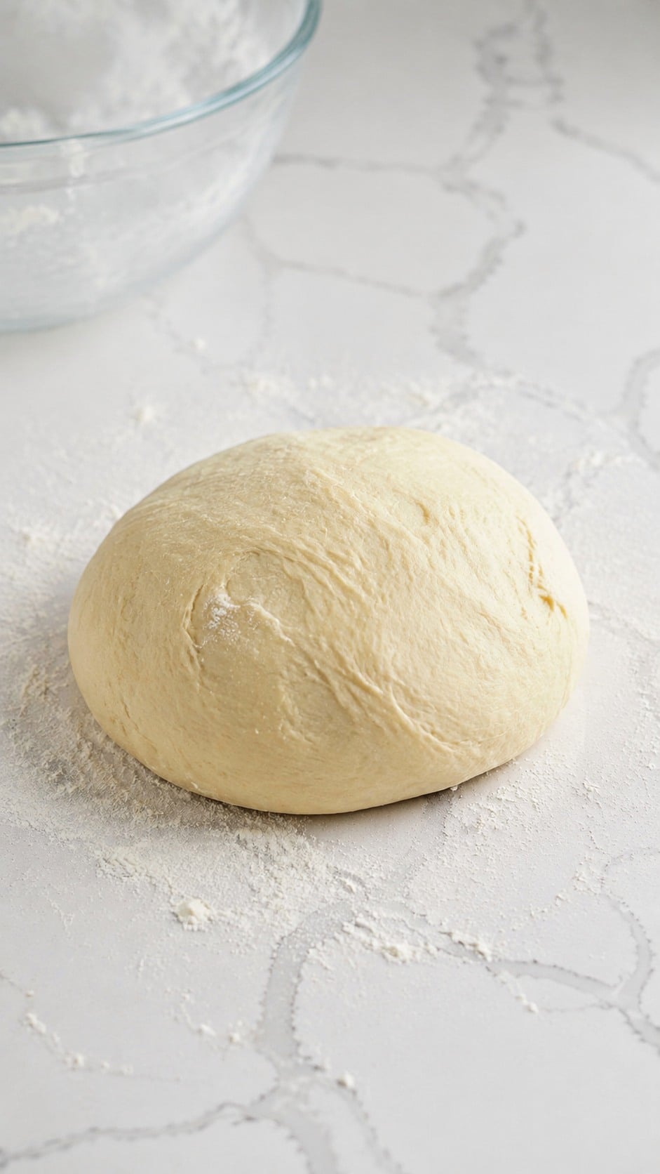 Soft, smooth yeast roll dough after adding flour and kneading.
