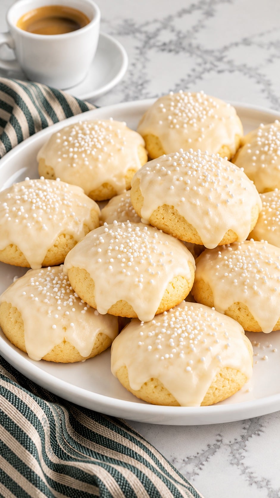 Italian Christmas cookies arranged on a white platter for serving.