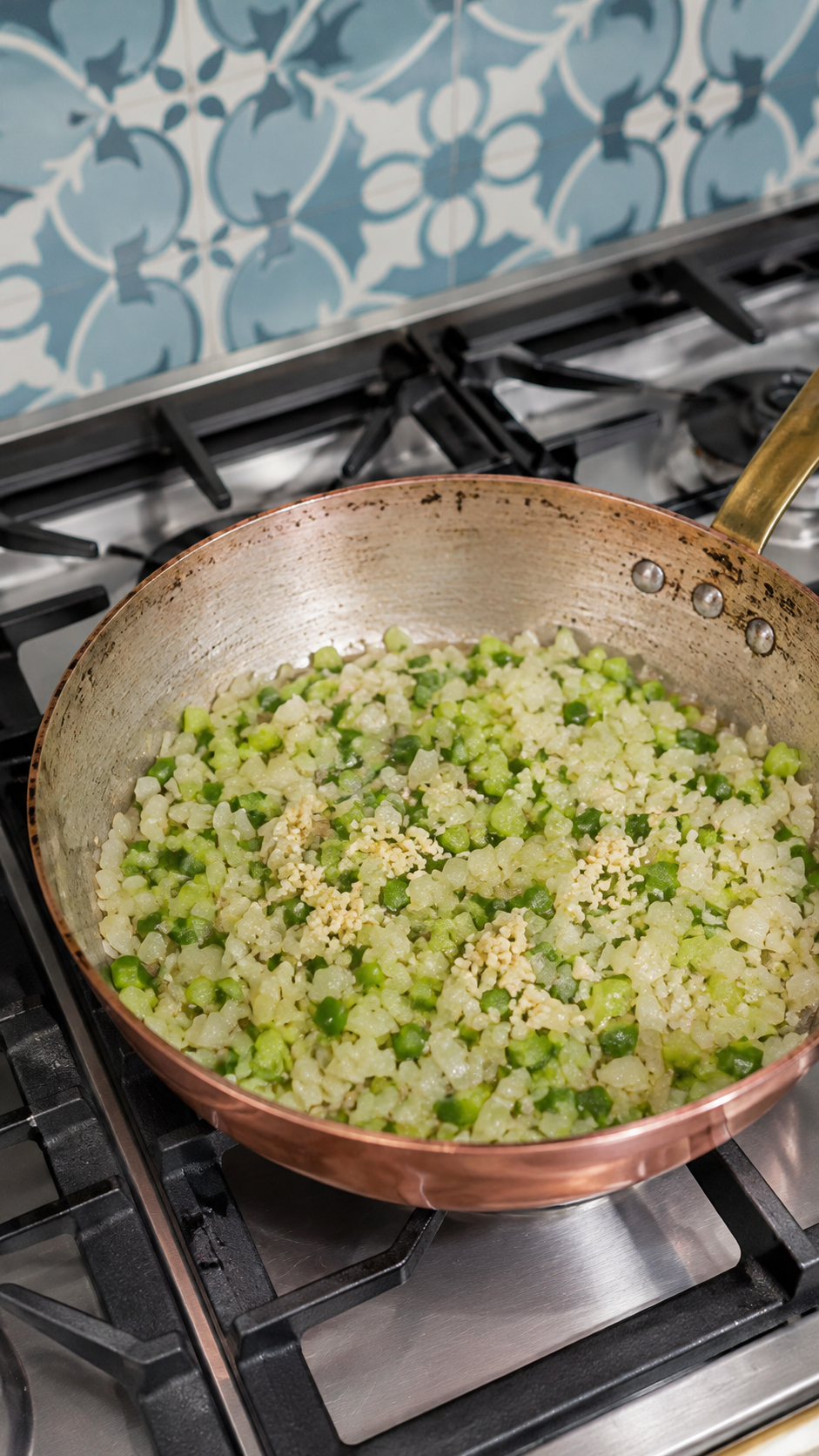 Onion, celery, green bell pepper, and garlic softened in butter