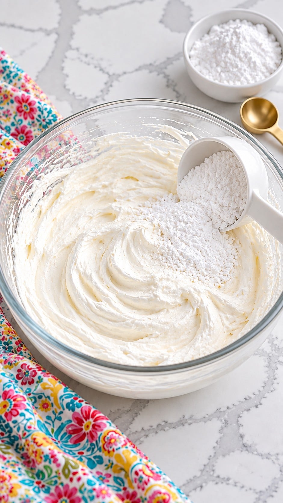 Optional powdered sugar being added to whipped cream.