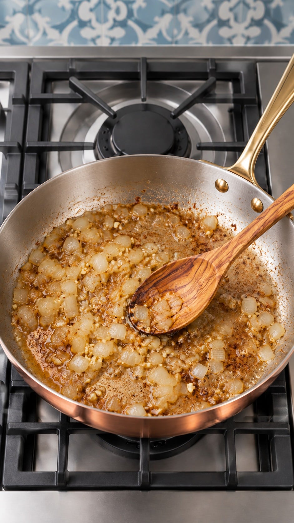 Softened diced onion and garlic with deglazed browned bits in the pan.
